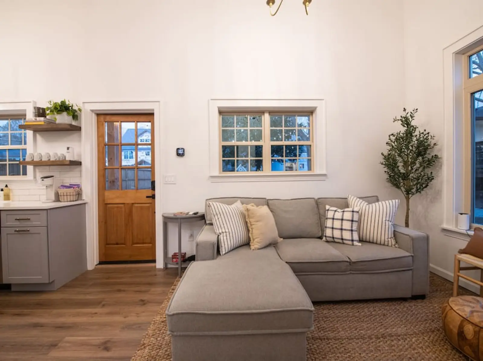 Cozy Cottage sectional sofa beneath large windows