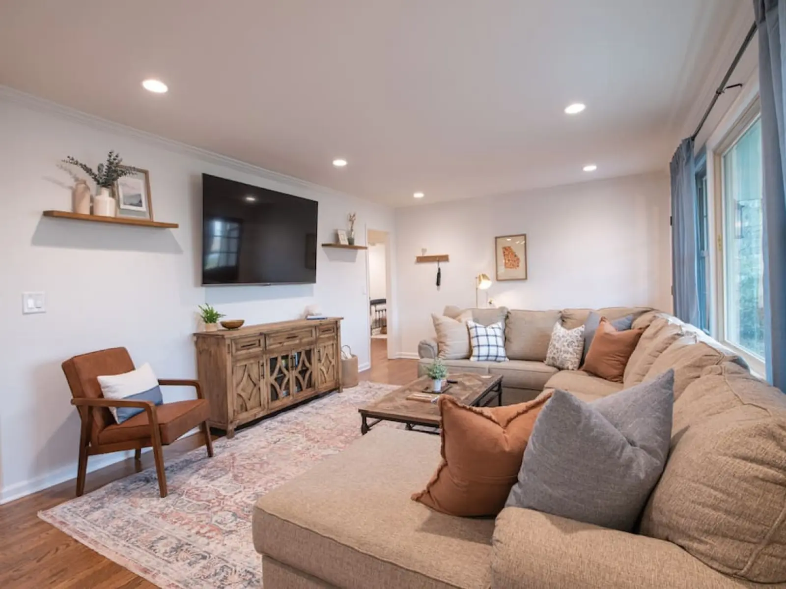 Crossing House living room with a large sectional sofa