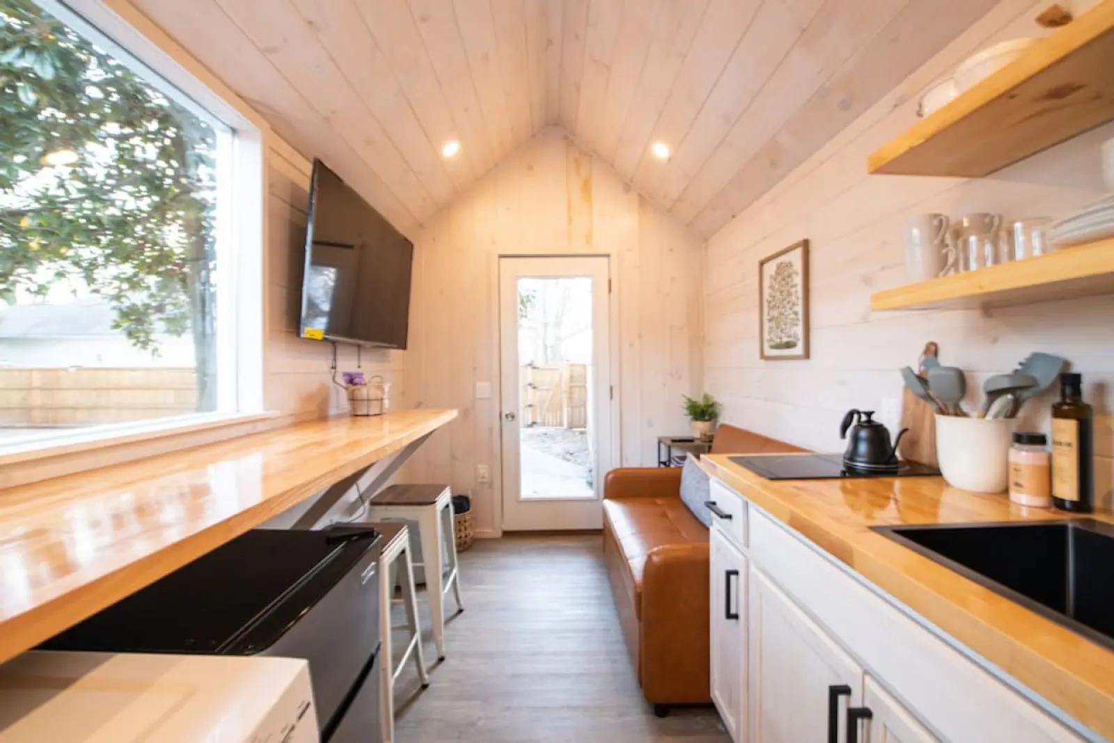 Magnolia Mini interior with butcher-block counter and a big picture window